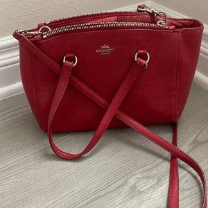 Red crossbody bag with two handles